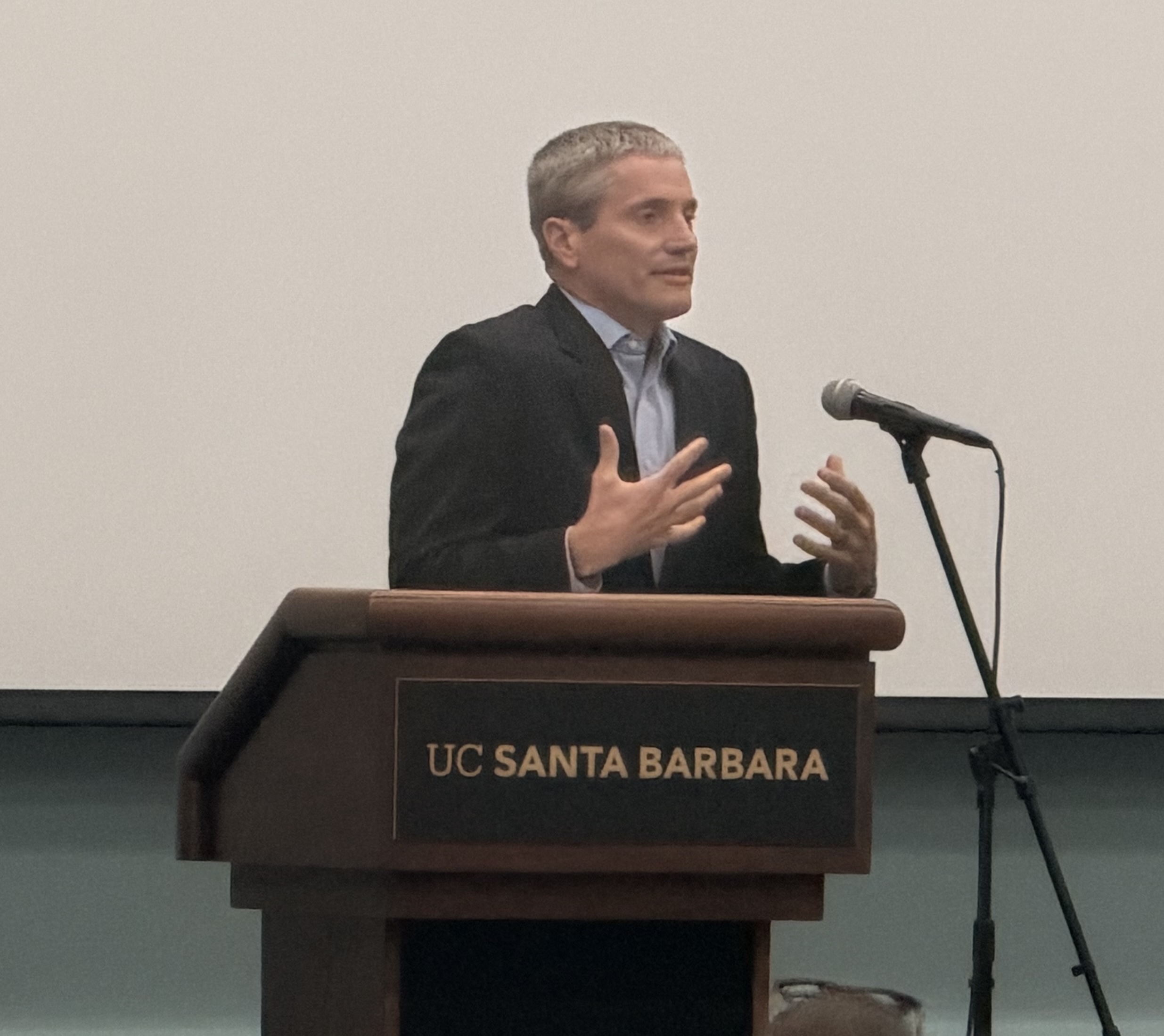California Natural Resources Secretary Wade Crowfoot speaks at a podium during the 42nd annual Steven Manley Memorial Lecture at Corwin Pavilion.