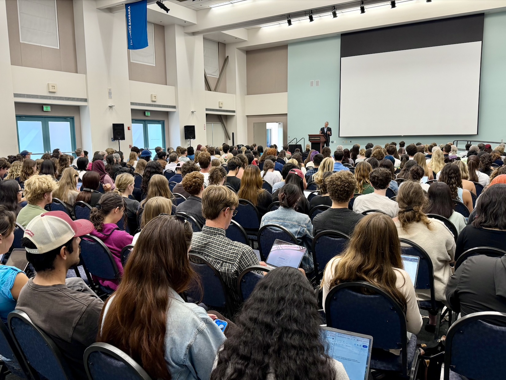 A large audience seated in Corwin Pavilion listening to Secretary Wade Crowfoot deliver a presentation from the stage.