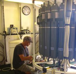 Craig Carlson samples ocean water for microbial and dissolved organic matter. 